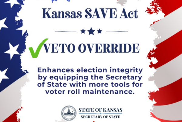 Graphic with an American flag background and text reading Kansas SAVE Act Veto Override. Enhances election integrity by giving the Secretary of State more tools for voter roll maintenance;