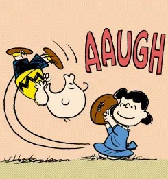 Charlie Brown flips in the air shouting AAUGH as Lucy pulls away a football