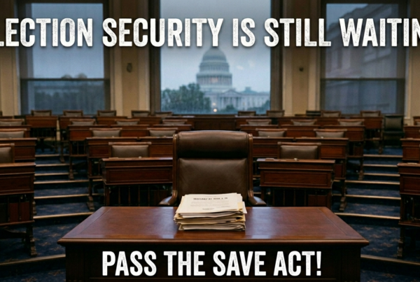 Empty congressional chamber with a stack of papers on a desk, the U.S. Capitol visible through the windows, and text reading: Election security is still waiting. North Carolina should update the early voting schedule—pass the SAVE Act!.
